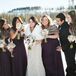 The bridesmaids wore floor-length plum dresses with faux fur stoles to match Kristen’s white fur stole.