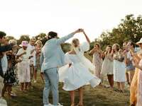 Bride and groom dancing down the aisle on wedding day
