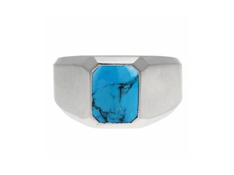 Emerald cut turquoise stone in center with thick white gold