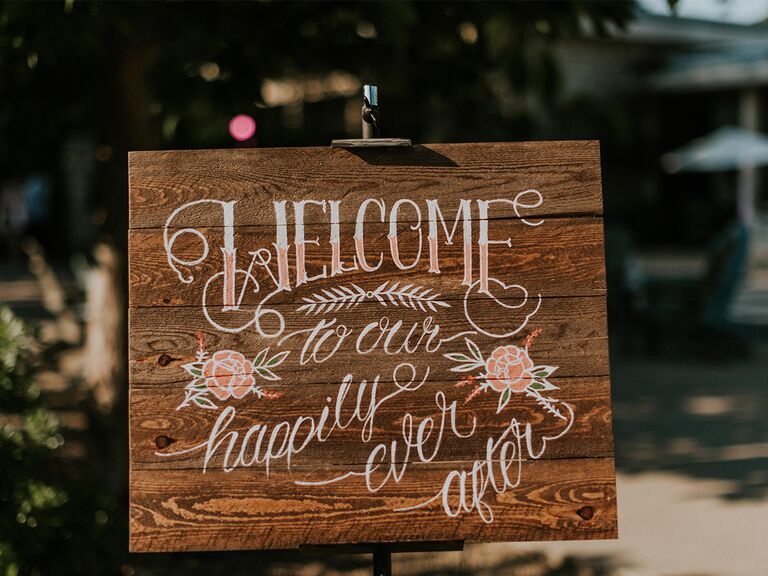 Wooden fairytale-themed wedding sign
