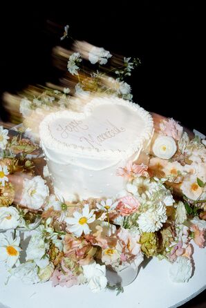 Double-Exposed Shot of Single-Tier, Heart-Shaped White Wedding Cake, Flowers