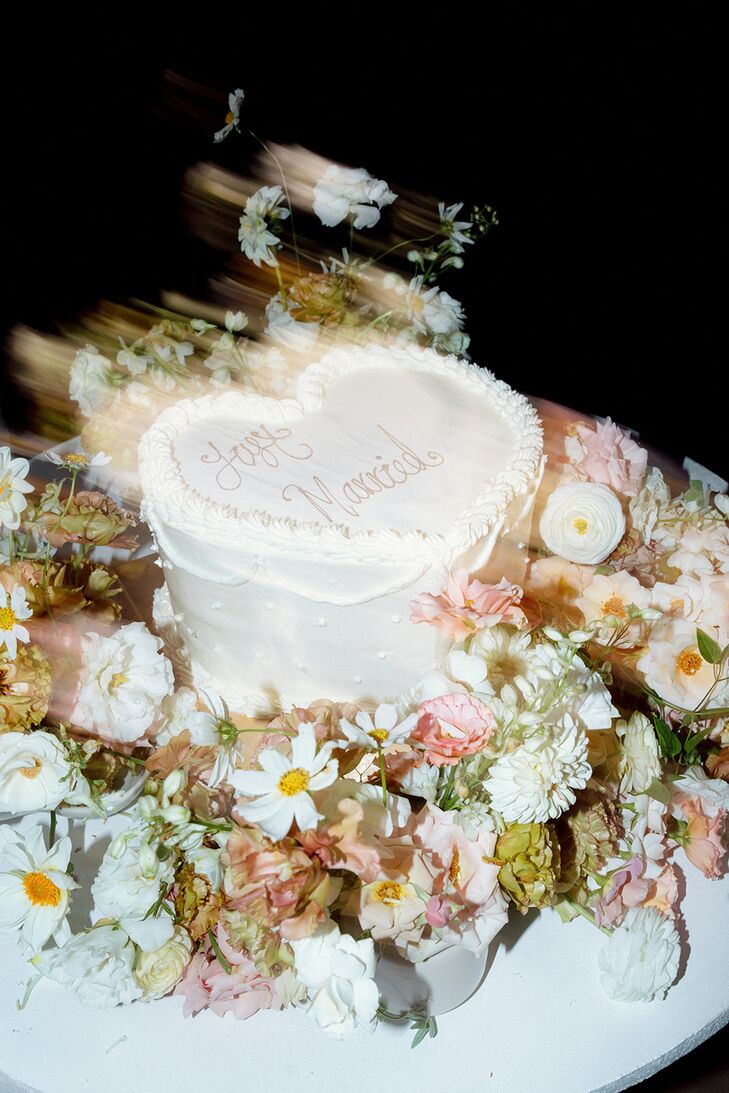 Double-Exposed Shot of Single-Tier, Heart-Shaped White Wedding Cake, Flowers