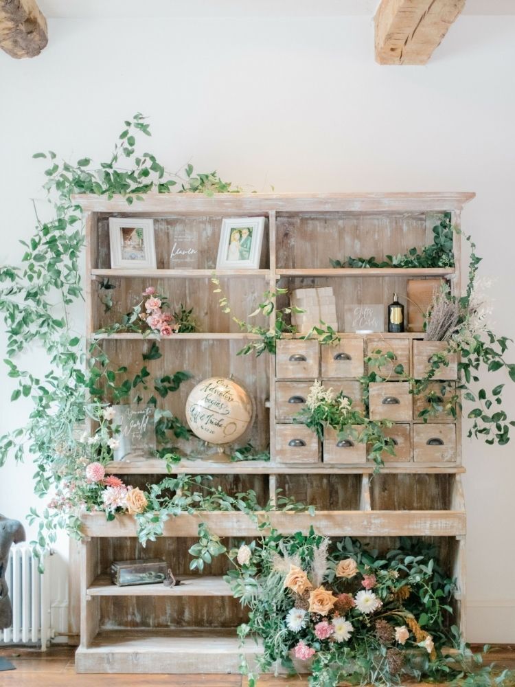 wood armoire with framed photos