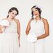 Of course, the bridesmaids also played the part of Gatsby-esque ladies with fun accessories. Each woman wore a neutral halter-strap dress with a pleated skirt and sash along the empire waist. For some added art deco flair, they rocked bold plum lipstick, pearl headbands and refined curled hairstyles. They even matched Jaris with handmade fabric rose bouquets.