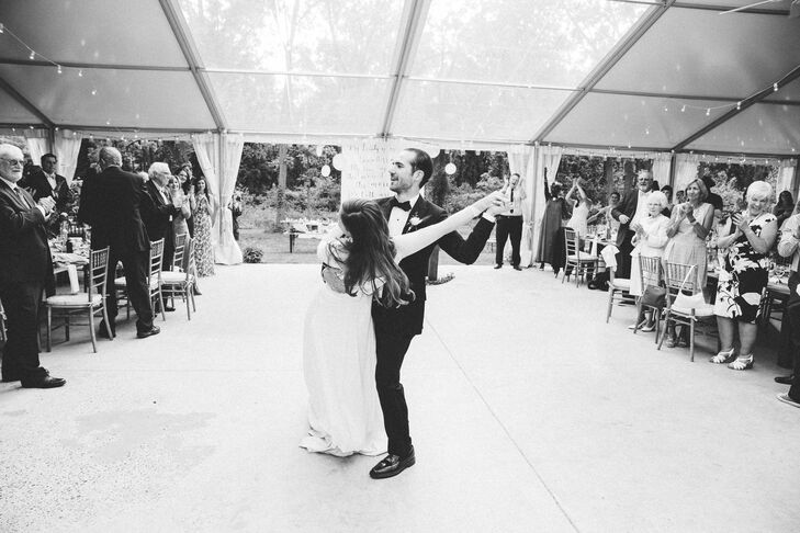 The couple's vintage style didn’t stop at their decor. Before the night was out, Lauren and Paul surprised their guests with a Foxtrot to "You Send Me" by Sam Cooke. "This was all his idea and it was a good one," Lauren says. Their white, tented reception space at Anthony Wayne House provided the perfect lighting so guests had a clear view of their first dance.