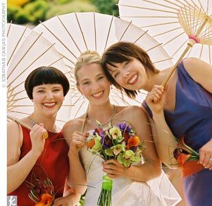Colby's two bridesmaids also got into the two-dress spirit. One wore a red chiffon Ann Taylor evening dress and an After Six taffeta gown in dark plum. The other donned a Waters and Waters dress in purple and orange taffeta, then switched to an After Six strapless two-piece made of black and silver taffeta.