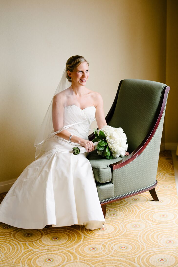 Inspired by the wedding's elegant, timeless theme, Meredith chose a Vera Wang gown in a strapless, trumpet silhouette. The dress featured draping along the bodice for an element of depth and texture.