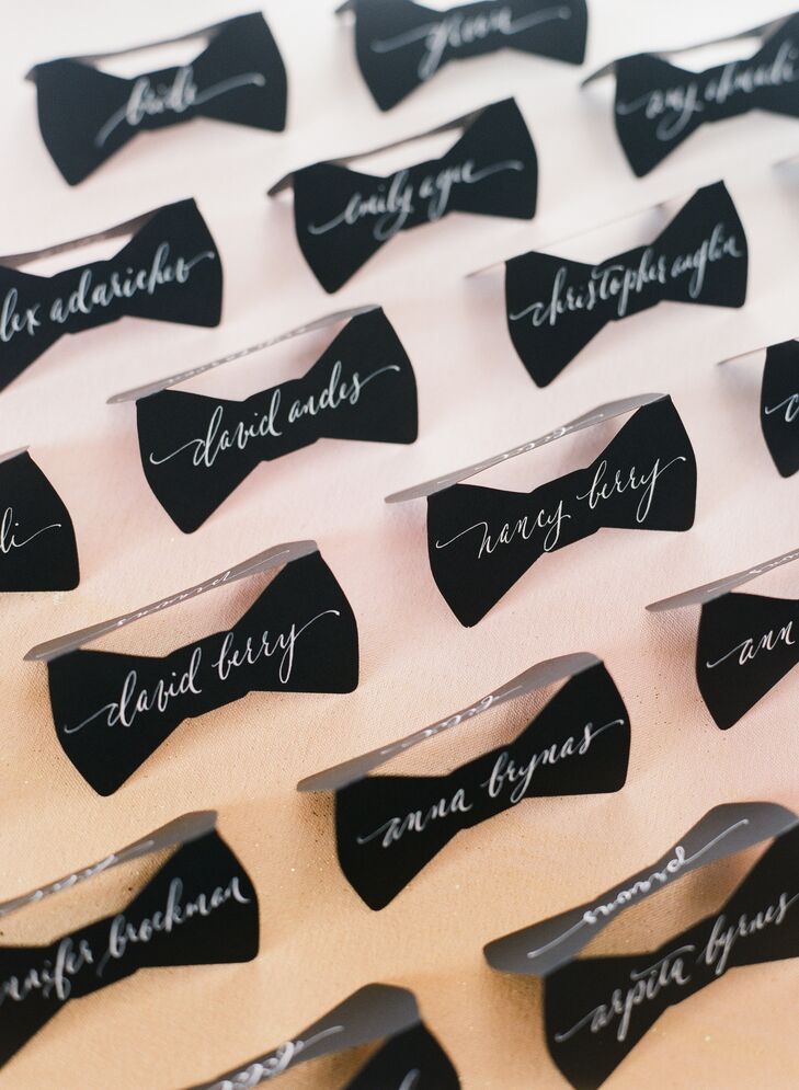 Lynn ordered adorable black bow tie escort cards for the wedding, and had their calligrapher use white ink to write each guest name onto the fronts and backs. “They turned out phenomenal and we received so many compliments on them,” she says. “Some guests still have them.”