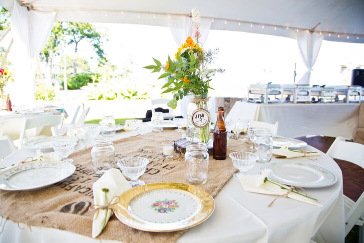 The couple decorated their relaxed tented reception with a "rustic vintage sea" theme. "It was burlap meets sailboats," says Shelly. "It was girl from Iowa meets boy from the coast and we wanted it to be extremely personal!"