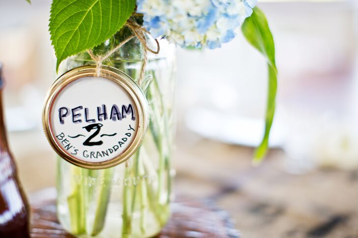A dear friend of the couple is a florist at A New Leaf in Chicago and worked with the couple's friends to arrange mixed local flowers in jars that were labeled with names of family members who had passed.