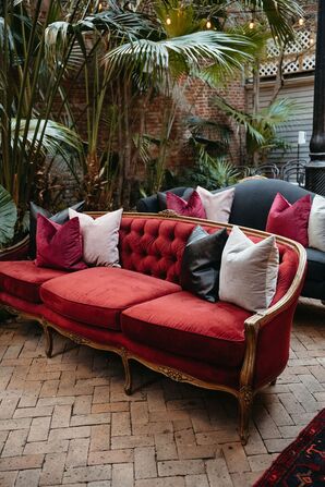 Red Velvet Sofa With White, Black and Red Pillows, Vintage Vibes