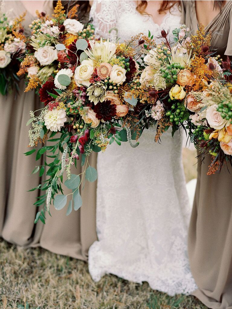 Autumnal orange, pink, ivory and purple fall wedding bouquets