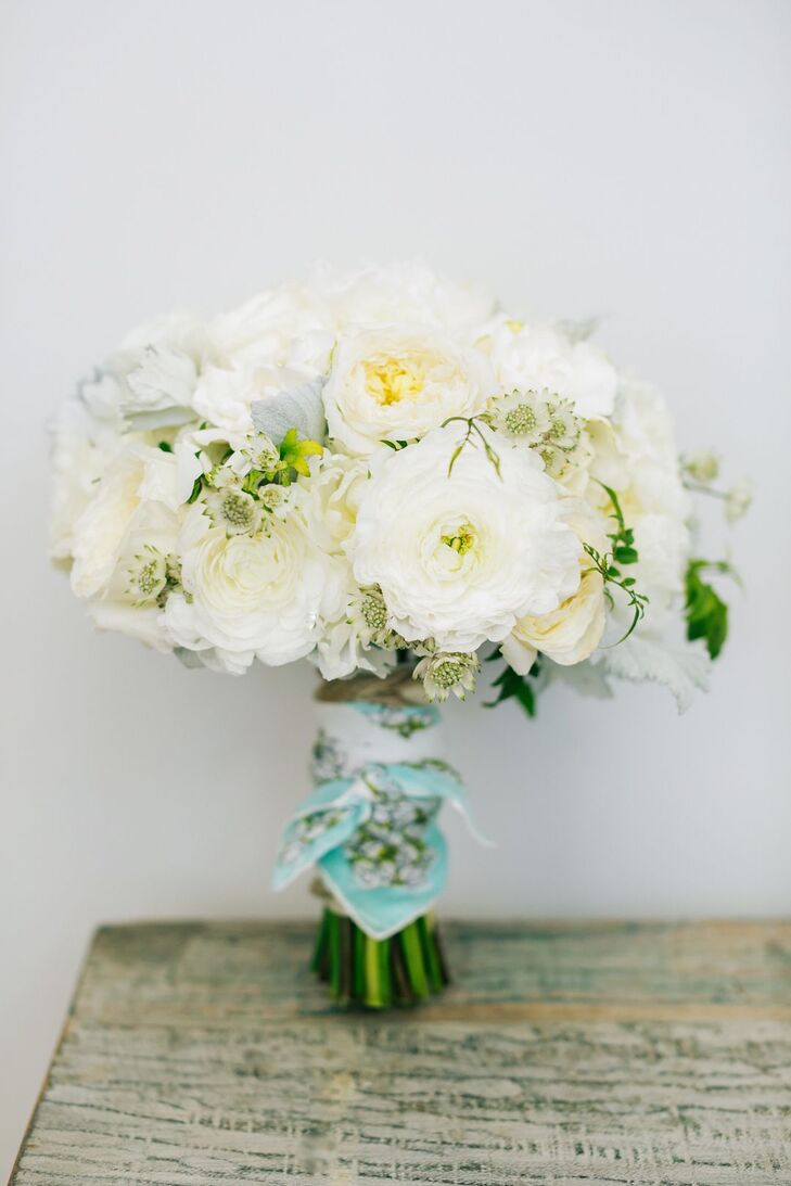 "My bridesmaid bouquets comprised white roses and dusty miller leaves with exposed stems wrapped with twine," says Leah, who relied on Orange's BloomBox Designs for all the day's flowers.
