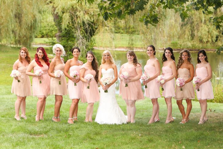 Lauren's bridesmaids wore short, chiffon dresses in blush and nude matching the soft color palette.