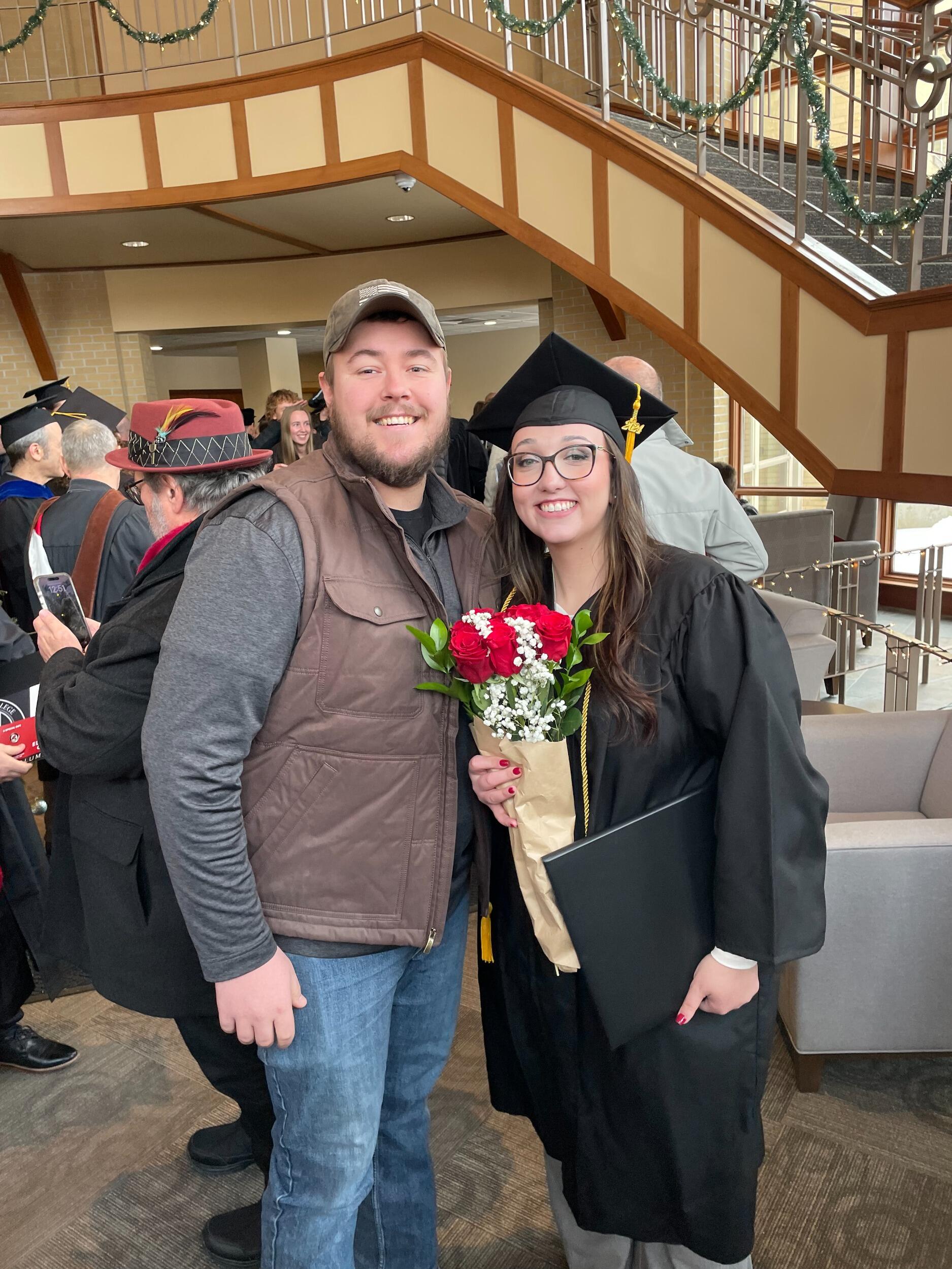 Clay supporting Lauren on graduation day