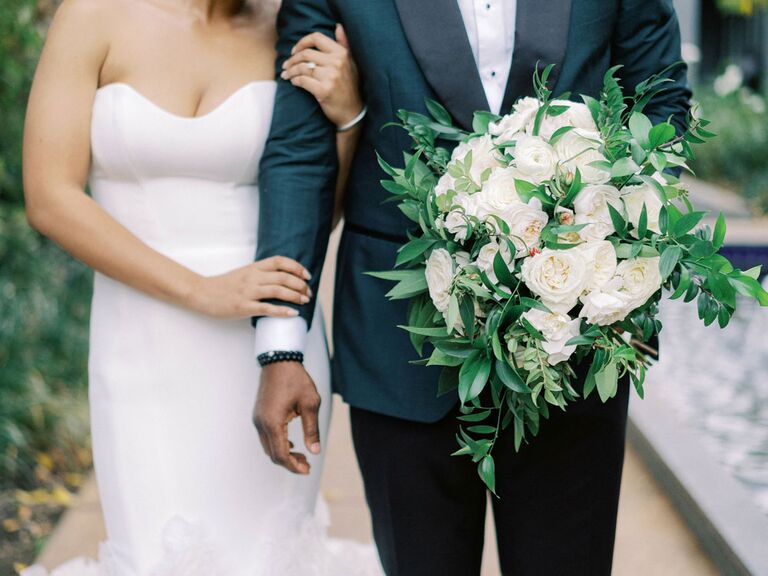 Bride and groom posing for portrait on wedding day