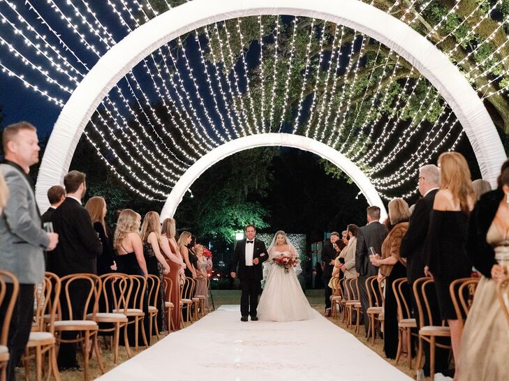Wedding Processional Under Canopy of String Lights