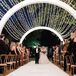 Wedding Processional Under Canopy of String Lights
