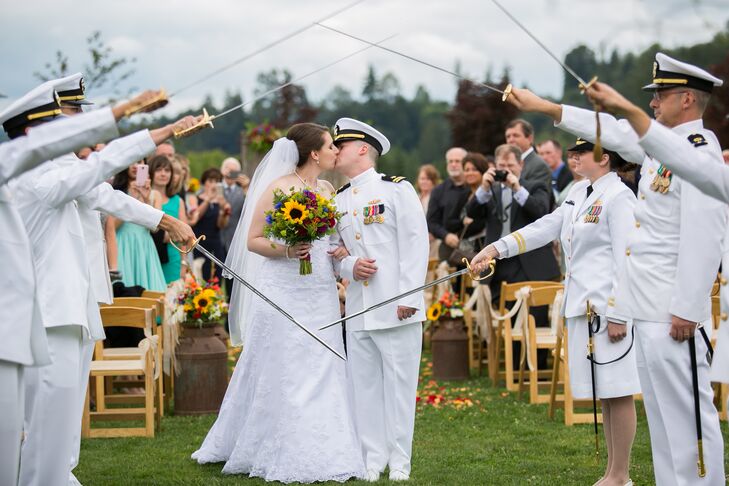 As Justine and Josh exited the ceremony, friends from the military lined the aisle and held their swords around the couple.