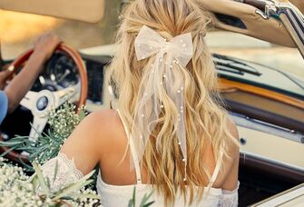 Beautiful hair bow embellished with pearls. 
