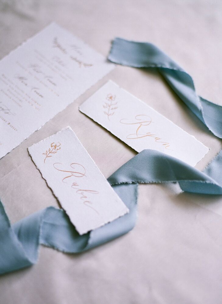 Elegant White Escort Cards with Dusty-Blue Ribbon
