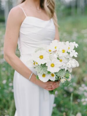 A Bride Holds a Natural, White Bouquet of Wildflowers