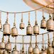 Calligraphed Brass Bells as Escort Card Alternatives