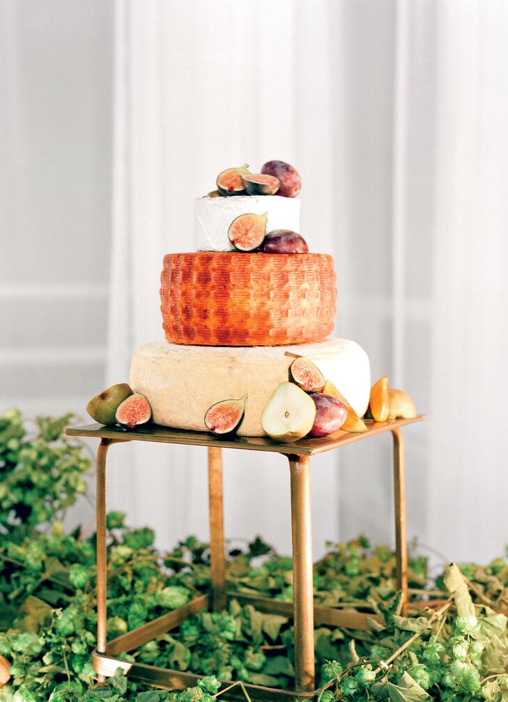 A big foodie, Lauren is usually disappointed by traditional wedding cake. As an alternative, the couple opted for stacked cheese wheels, homemade candy bars and doughnuts.