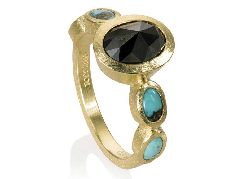  Oval black diamond ring with oval cabochon turquoise side stones