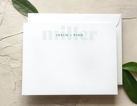 Names in small minimalist teal type with bigger light green last name in background