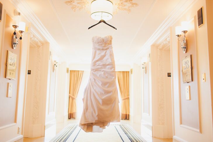 My-Lee wore an elegant sheath wedding dress with a sweetheart neckline and an attached court length train.