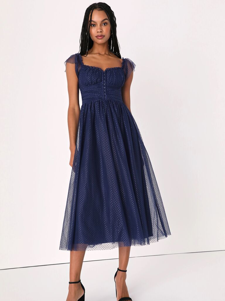 Navy spring wedding guest dress with corset bodice and flutter sleeves