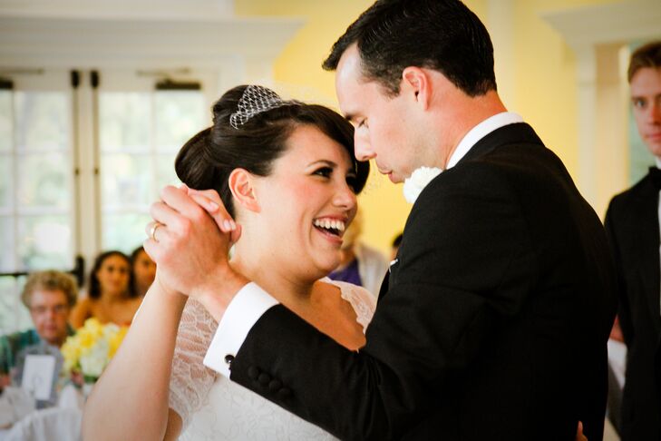 Brandy had her hair styled into an updo and wore an ivory vintage birdcage veil. In this shot, the couple had their first dance as husband and wife to a song by Sam Cooke in front of loved ones at the reception. Brandy and John shared a love for classic songs, so they had their DJ playing oldies all night.