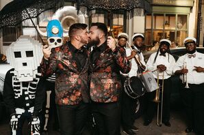 Grooms in Matching Black-and-Red-Floral Jackets Kiss, Second-Line Band, Parasols