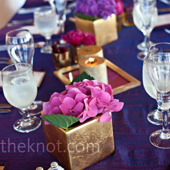 Half of the dinner tables were topped with gold hydrangea-filled boxes.