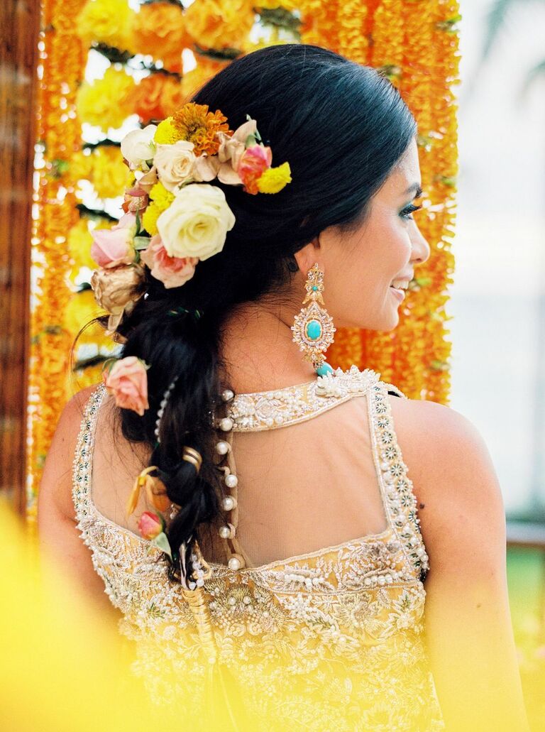 Bride with yellow flowers in braided updo
