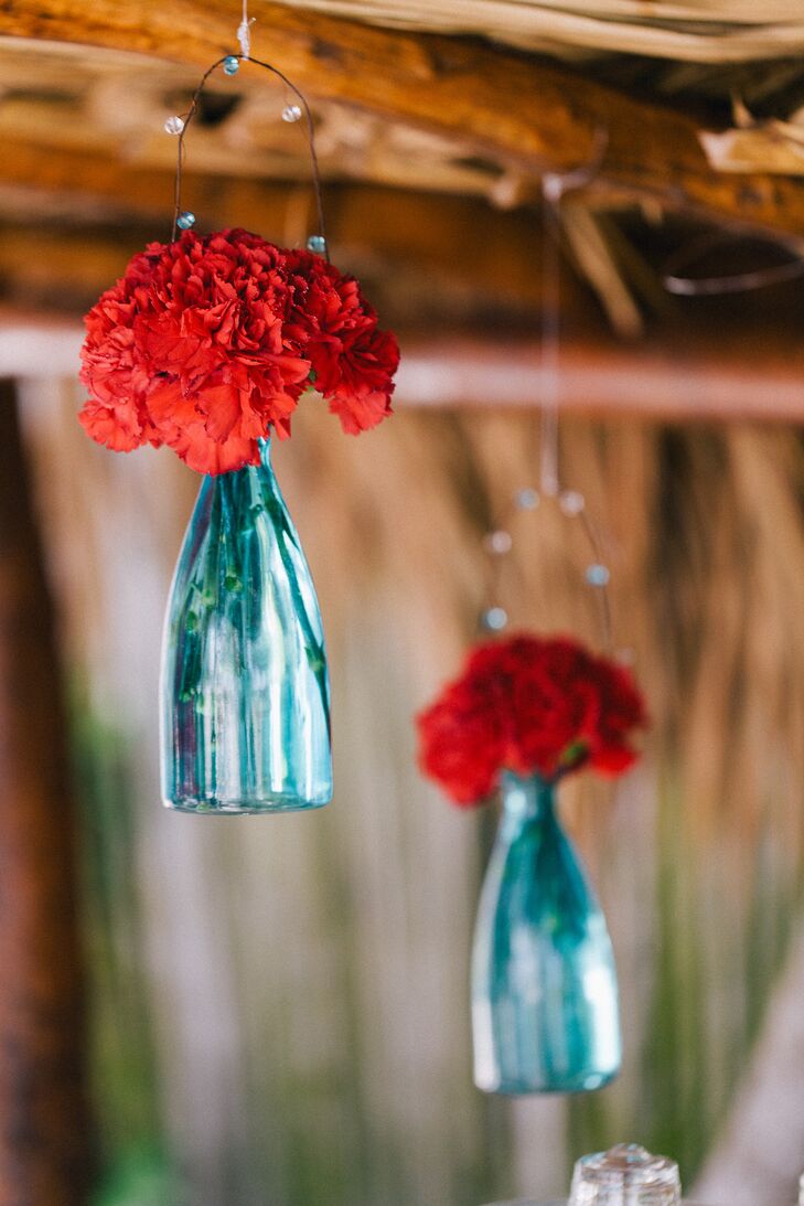 Hanging Red Flowers Blue Vases