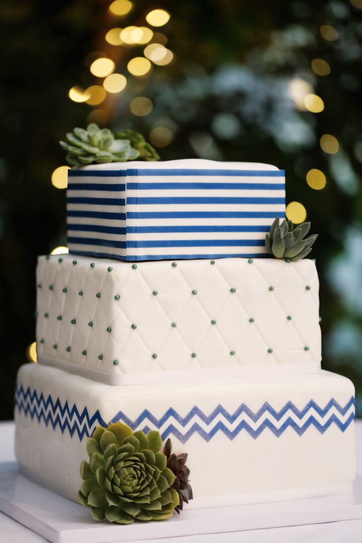 Salt City Bakery created Courtney and John's contemporary three-tier cake with modern patterns such as stripes and chevron, which were used throughout the reception.