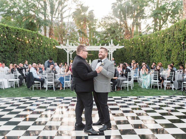 Same sex couple grooms first dance at reception