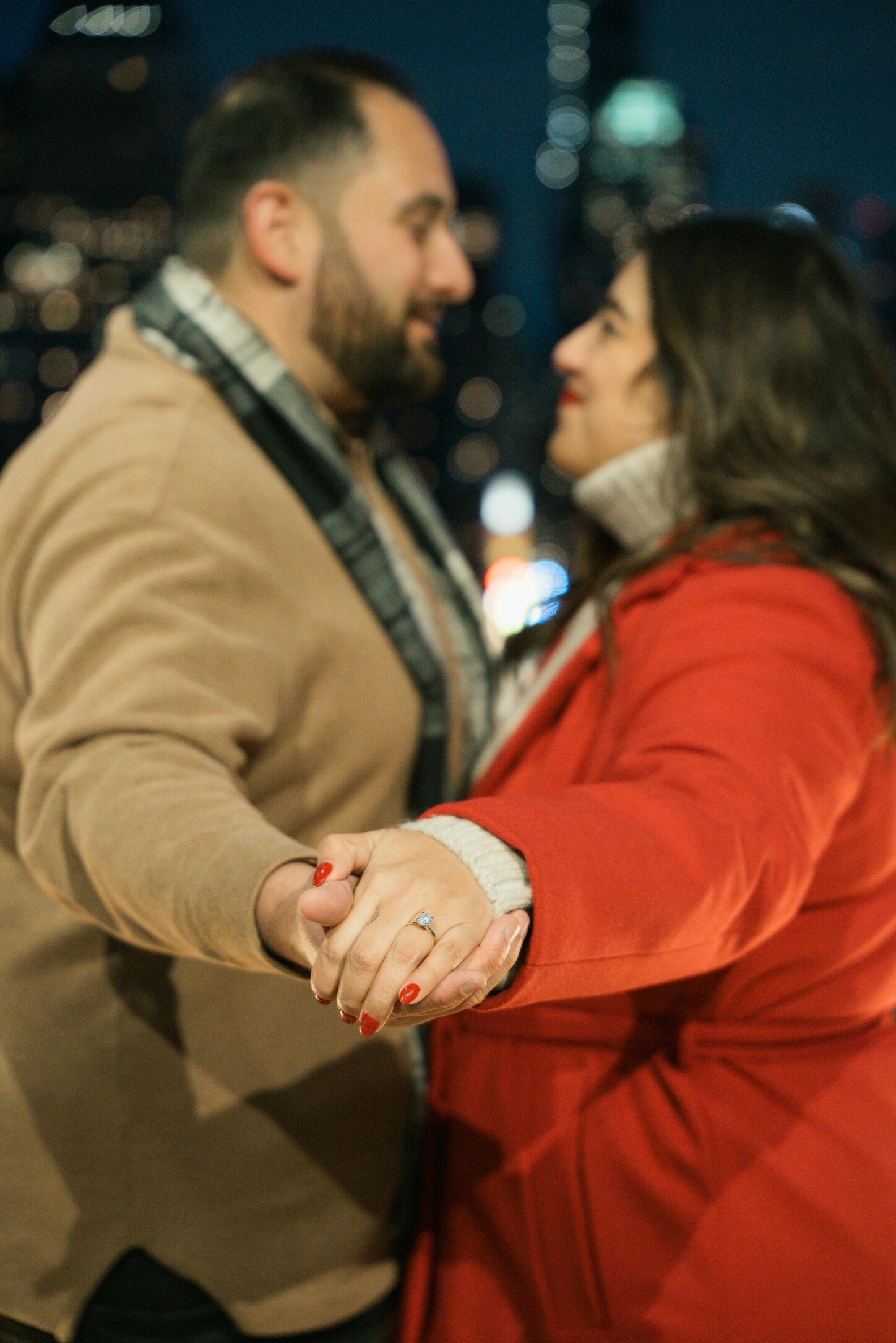 Nauder asked Sanny to marry him on a beautiful rooftop in NYC- she said yes! He invited both parents and Godparents for the surprise of a lifetime!