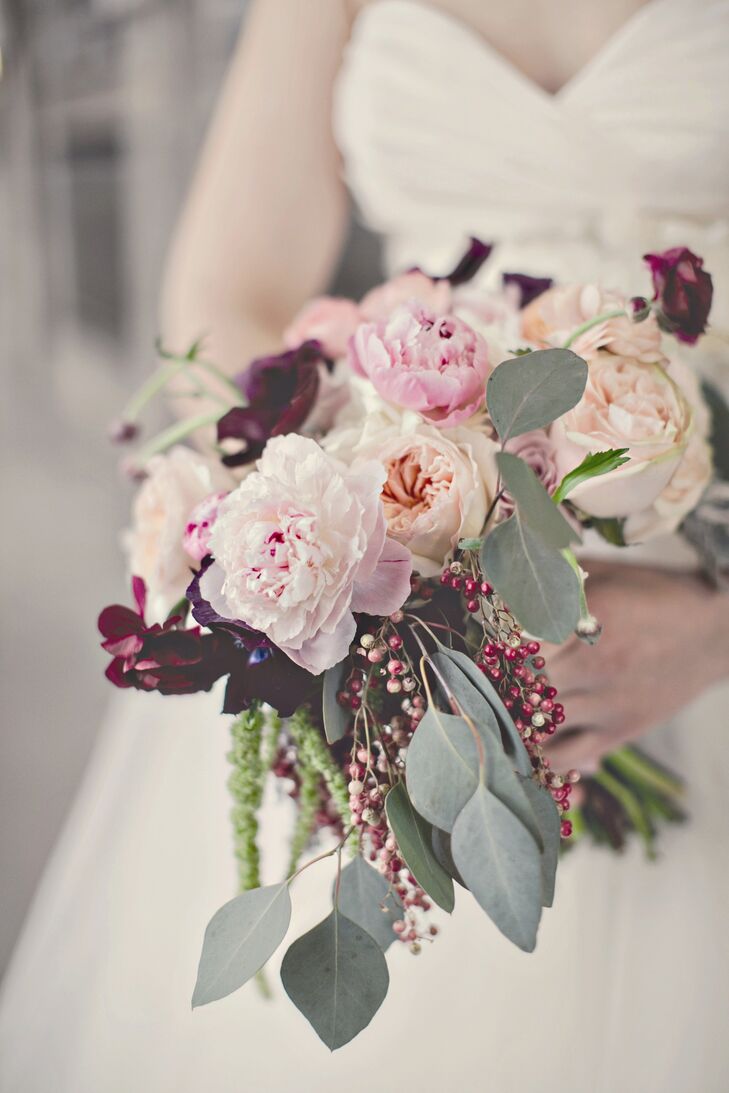 Emily carried a lush gathering of pink peonies and garden roses combined with burgundy ranunculus and berries.