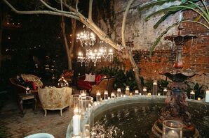 Courtyard at Night, Chandeliers, Tea Light Candles Around Fountain, Lounge Furniture