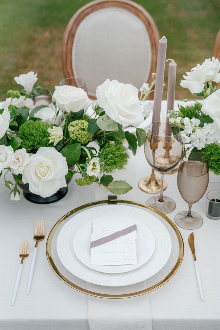 Gray-and-White Place Setting With White Rose and Green Trick Dianthus Flower Arrangements, Gray Stemware and Gold Flatware