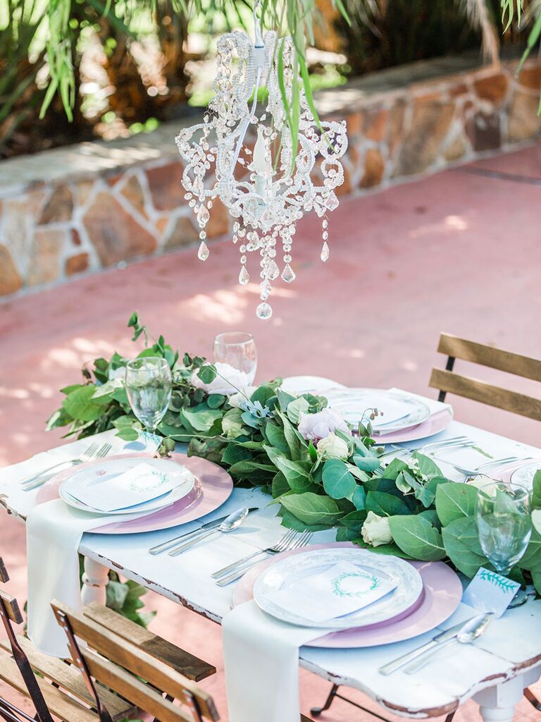 A Natural, Pastel Table Setting Accented With Greenery