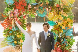 Ceremony With Colorful Flower Arch at Waller Creek Boathouse in Austin, Texas