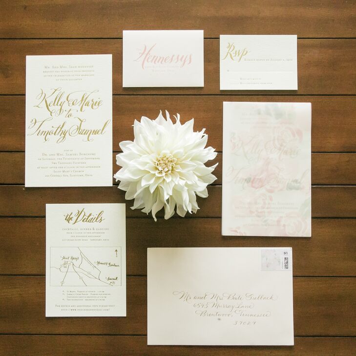 “I wanted something different yet classic, so we did cardstock with gold foil script,” says Kelly. “ Instead of using the traditional tissue paper, we decided to go with a translucent floral paper insert which Deanna painted herself and made copies of.”