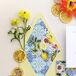 Unique and beautiful yellow-and-blue invitation suite featuring lemons, including lemon place cards, and intricate blue designs for a couple's Italian-themed rehearsal dinner.