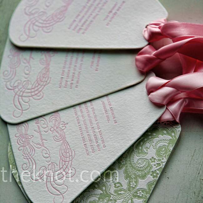 Fans with an intricate green pattern, pink ribbon, and the same fonts used in the invitations took the place of more traditional programs.