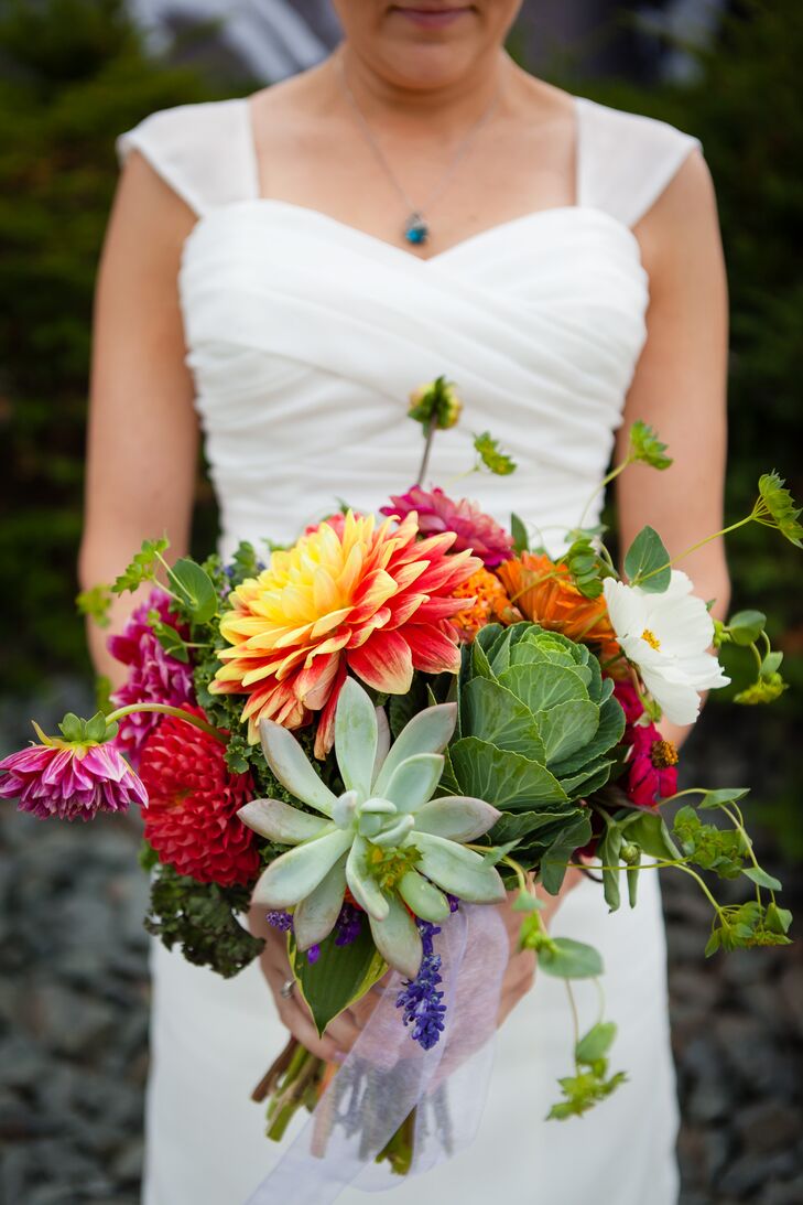 Anna carried a totally cool bouquet for her rustic, vintage wedding. Florist Mickey O'Kane included a cabbage along with more traditional dahlias, succulents, zinnias and wildflowers. We loved the pop of color and bold texture.
