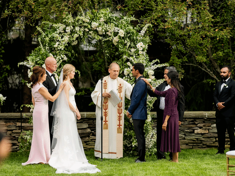 Catholic interfaith officiant at an outdoor wedding. 